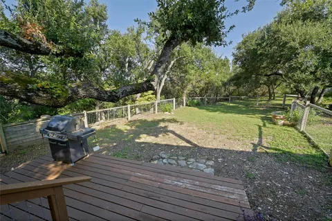 a view of a backyard with sitting area