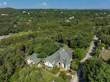 an aerial view of residential house with outdoor space