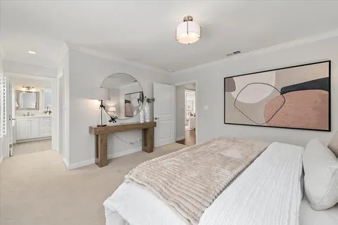 a bedroom with a bed and ceiling fan