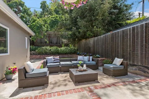 a outdoor living space with furniture and a potted plant