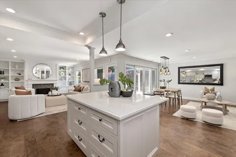 a view of living room and kitchen island with furniture