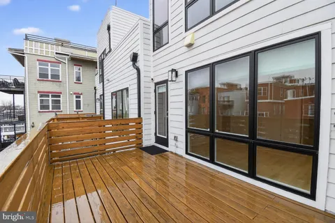 a spacious bathroom with a glass door