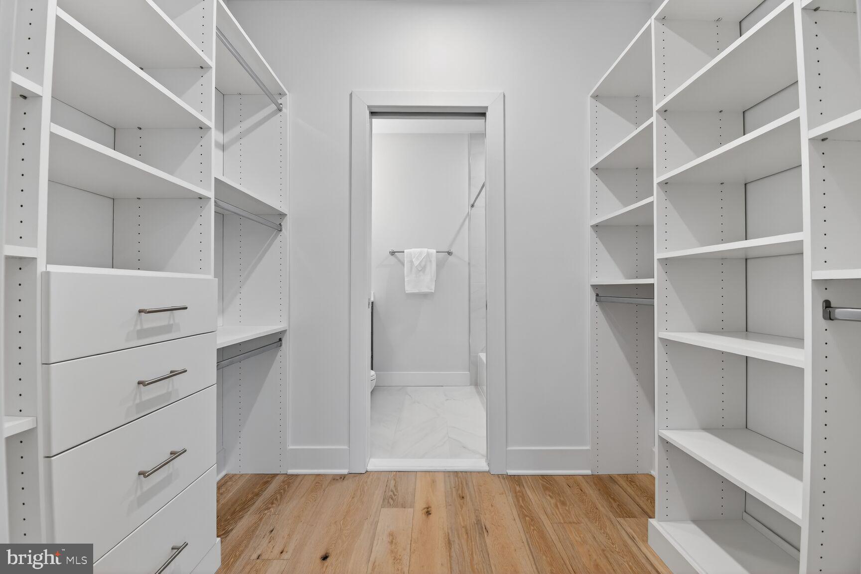 3532 1/2 13th Street Northwest, Unit 2 Washington, DC 20010 - Photo 22 of 38 a view of walk in closet with empty racks