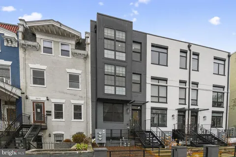 a front view of a building with street view