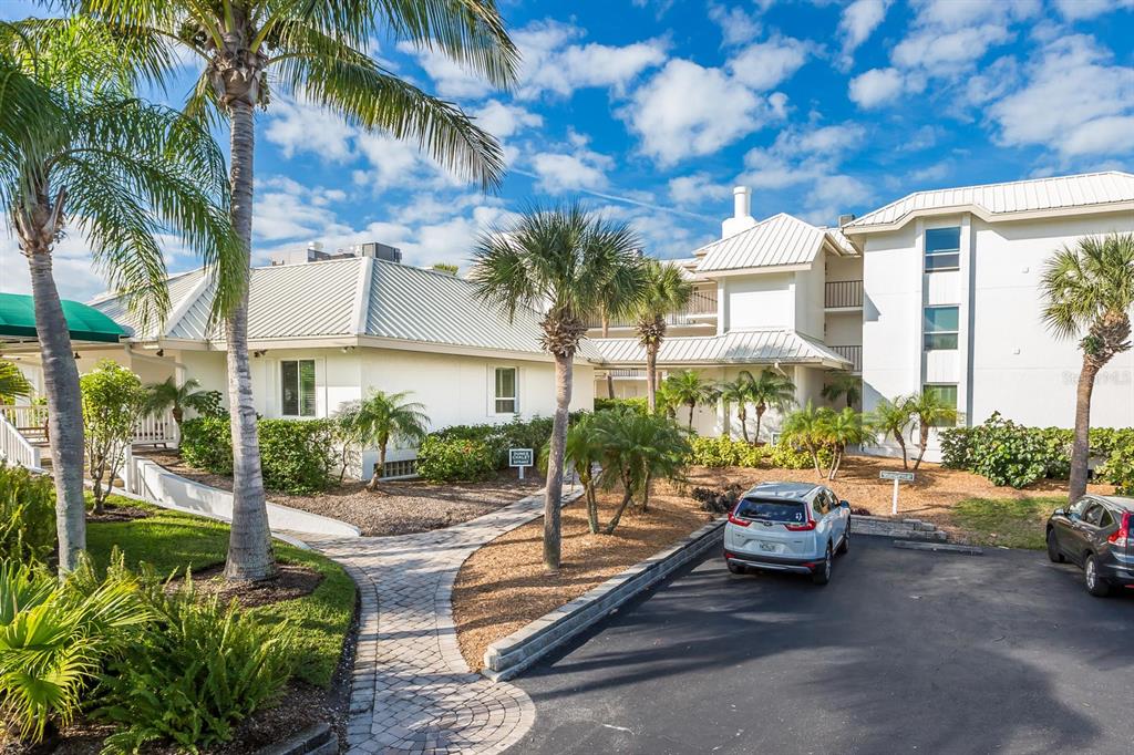 5000 Gasparilla Road, Unit DC307 Boca Grande, FL 33921 - Photo 1 of 33 a view of a house with backyard and sitting area