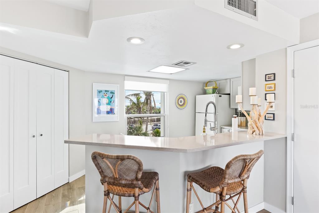 5000 Gasparilla Road, Unit DC307 Boca Grande, FL 33921 - Photo 5 of 33 a dining room with furniture and window