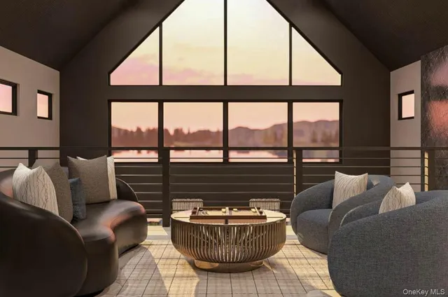 a living room with furniture and a floor to ceiling window