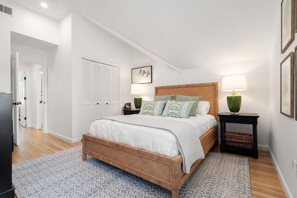 27 R West Street, Unit 13 Beverly, MA 01915 - Photo 18 of 34 a spacious bedroom with a bed and a rug