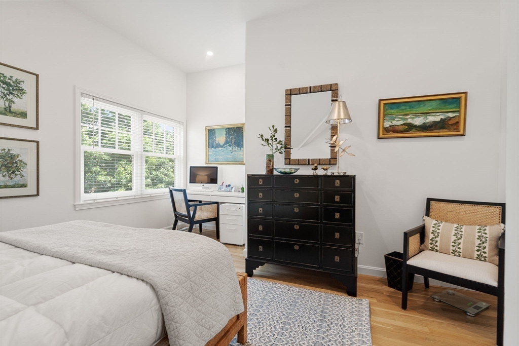 27 R West Street, Unit 13 Beverly, MA 01915 - Photo 19 of 34 a bedroom with a bed and a table