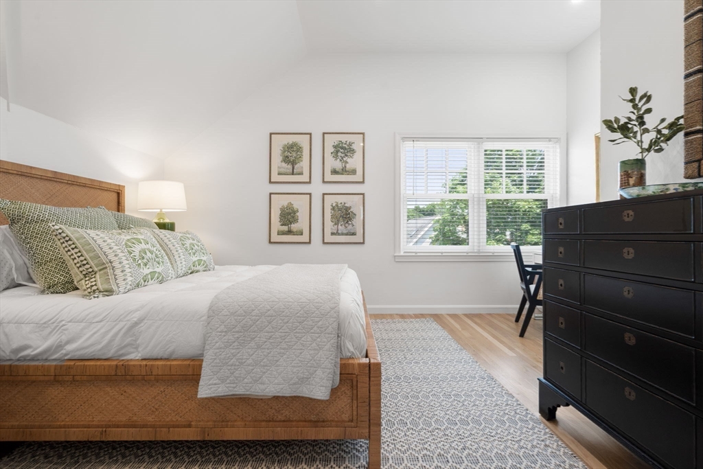 27 R West Street, Unit 13 Beverly, MA 01915 - Photo 20 of 34 a bedroom with a bed and windows