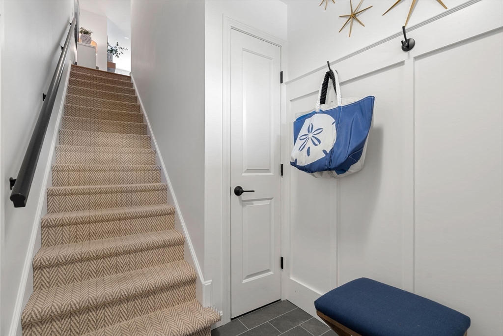 27 R West Street, Unit 13 Beverly, MA 01915 - Photo 31 of 34 a view of entryway with stairs and wooden floor
