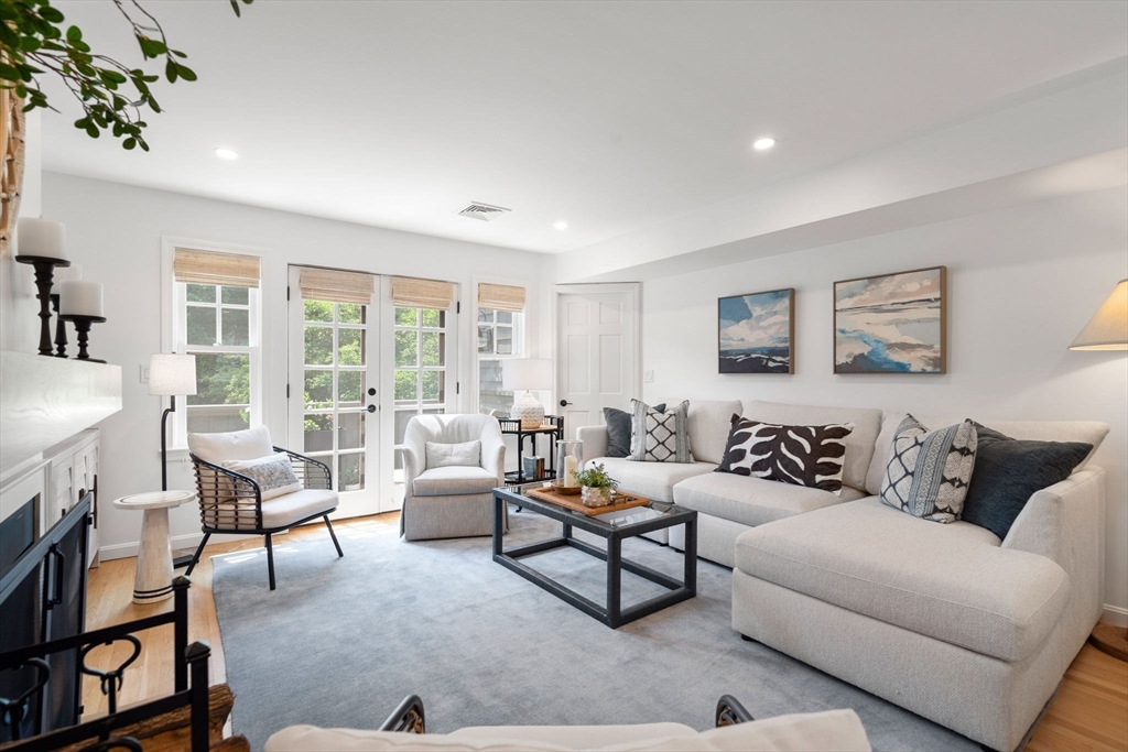 27 R West Street, Unit 13 Beverly, MA 01915 - Photo 5 of 34 a living room with furniture and a large window