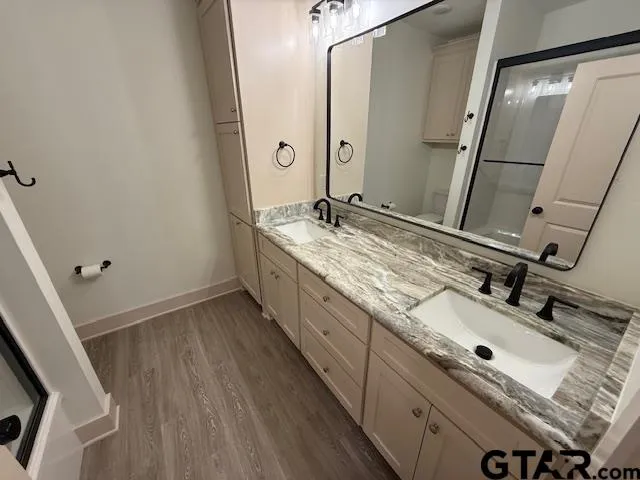 a bathroom with a sink and a mirror