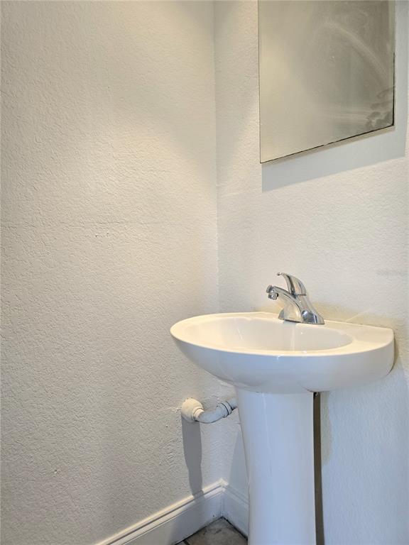 1930 South Conway Road, Unit 2 Orlando, FL 32812 - Photo 12 of 25 a sink with a mirror