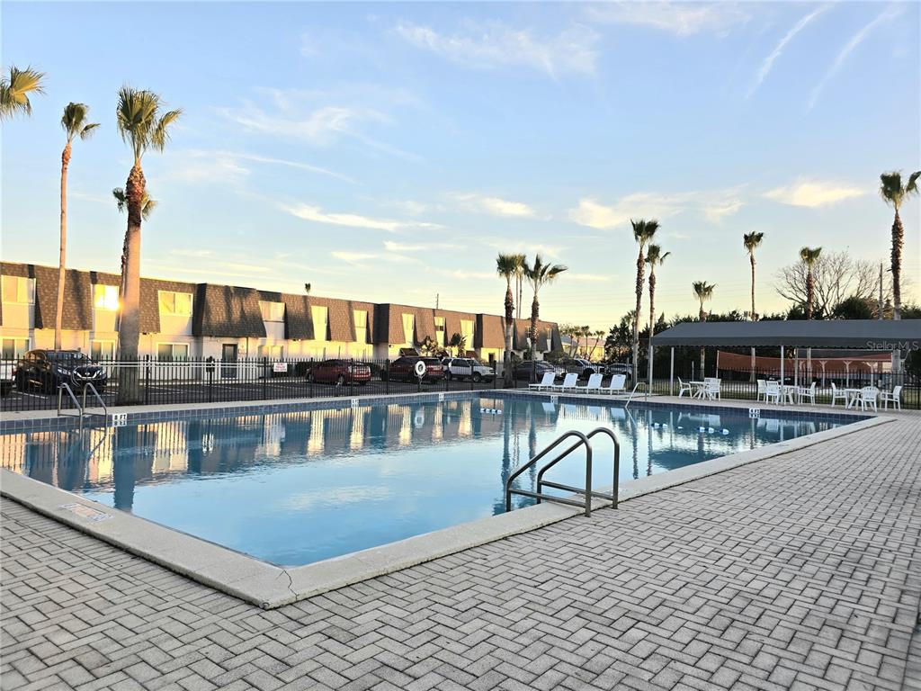 1930 South Conway Road, Unit 2 Orlando, FL 32812 - Photo 24 of 25 a view of a swimming pool with outdoor seating