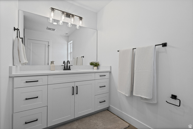 340 East 7635 S Street Sandy, UT 84047 - Photo 17 of 32 Bathroom with vanity and baseboards