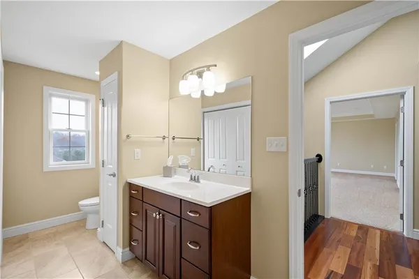 a bathroom with a sink vanity and a mirror