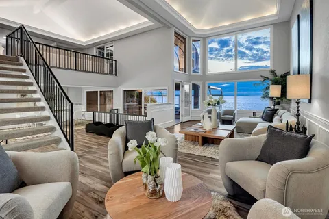 a living room with furniture or couch and a potted plant