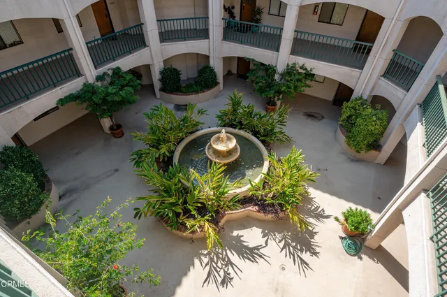 a view of a swimming pool with lounge chairs