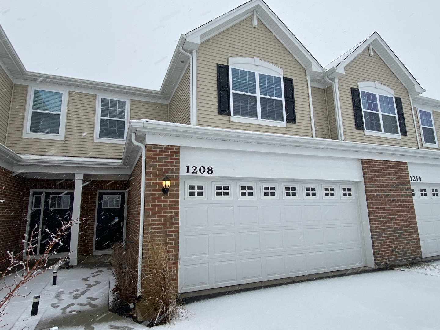 a front view of a house with white walls