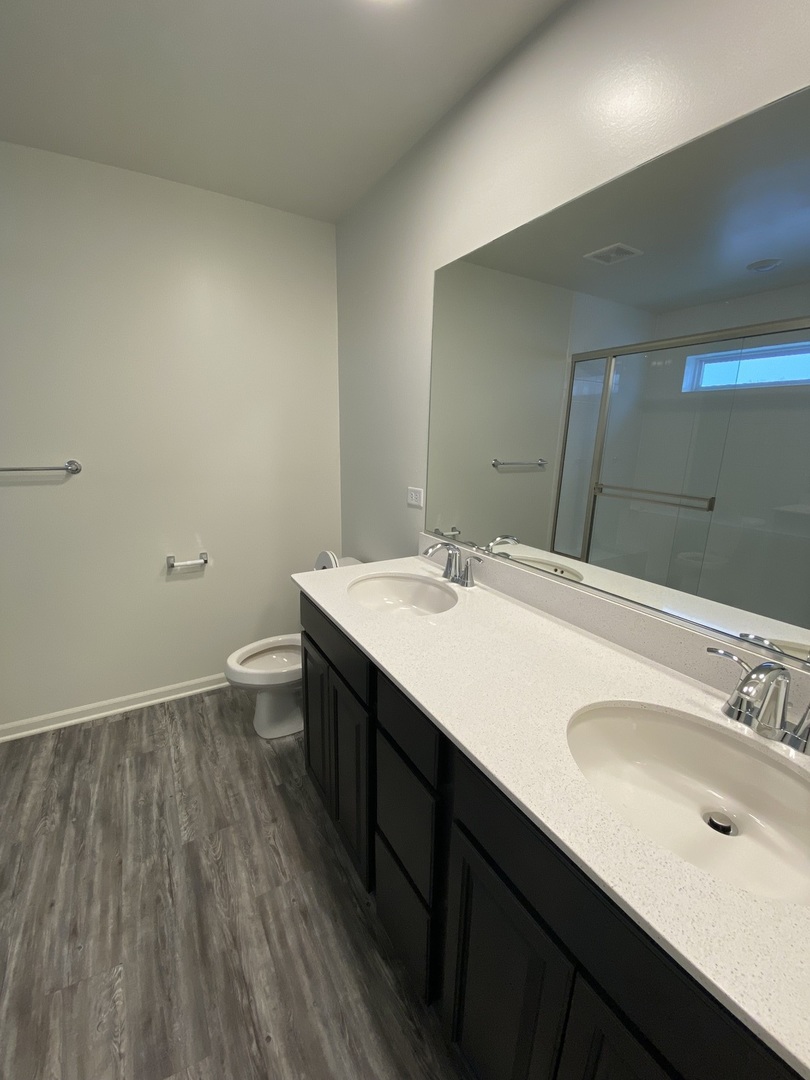 1208 Draper Road McHenry, IL 60050 - Photo 12 of 22 a bathroom with a sink and a mirror