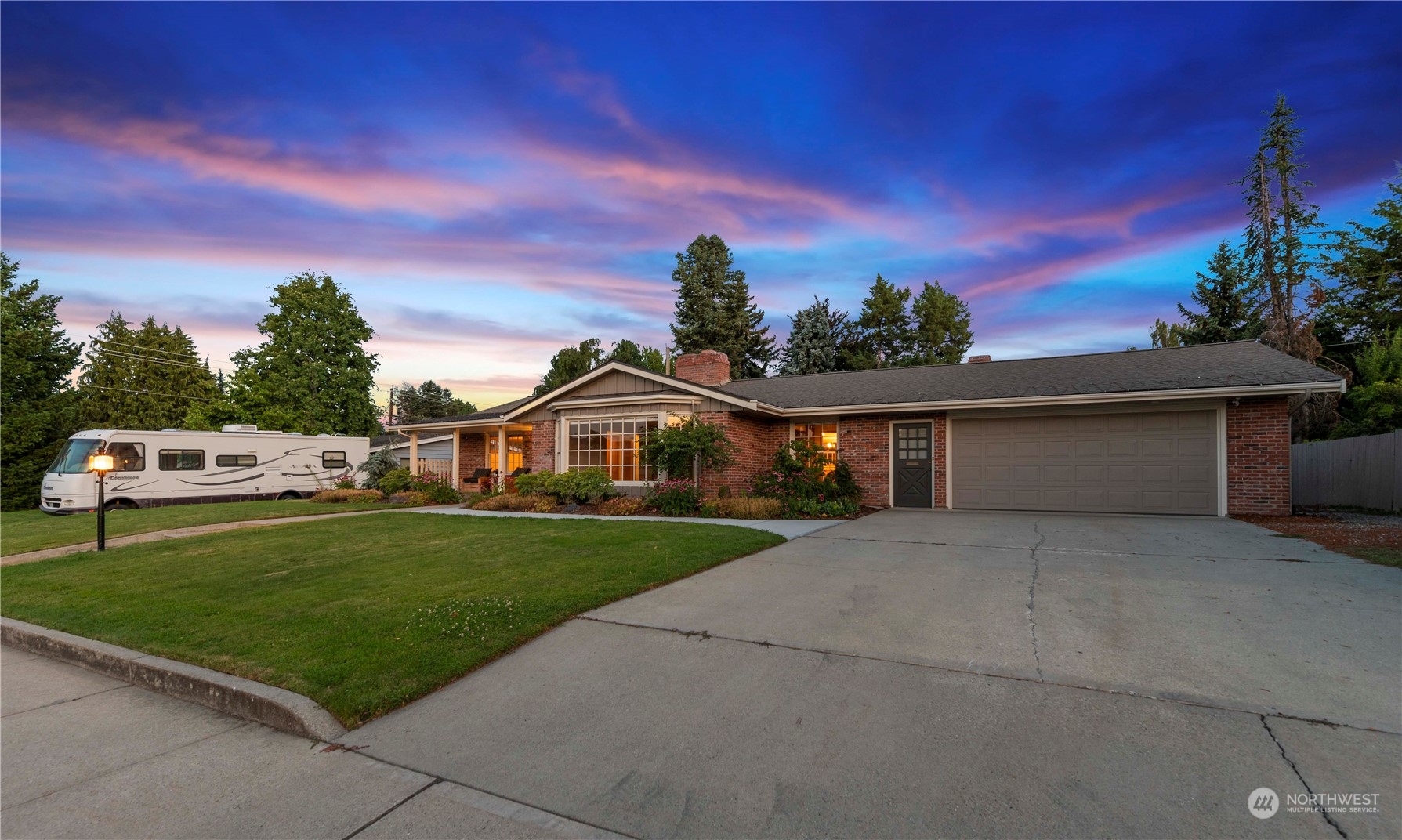 1405 First Street Wenatchee, WA 98801 - Photo 2 of 40 a front view of a house with a yard and garage