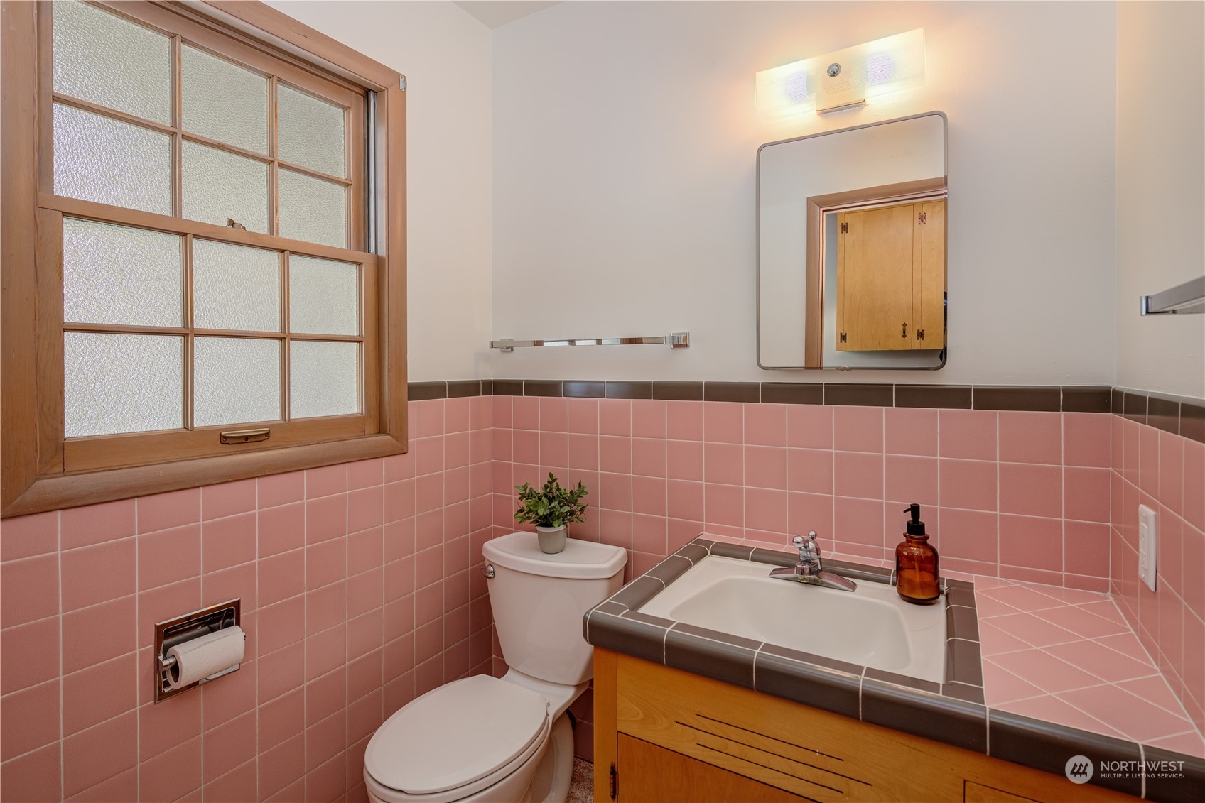 1405 First Street Wenatchee, WA 98801 - Photo 30 of 40 a bathroom with a sink a toilet and a mirror