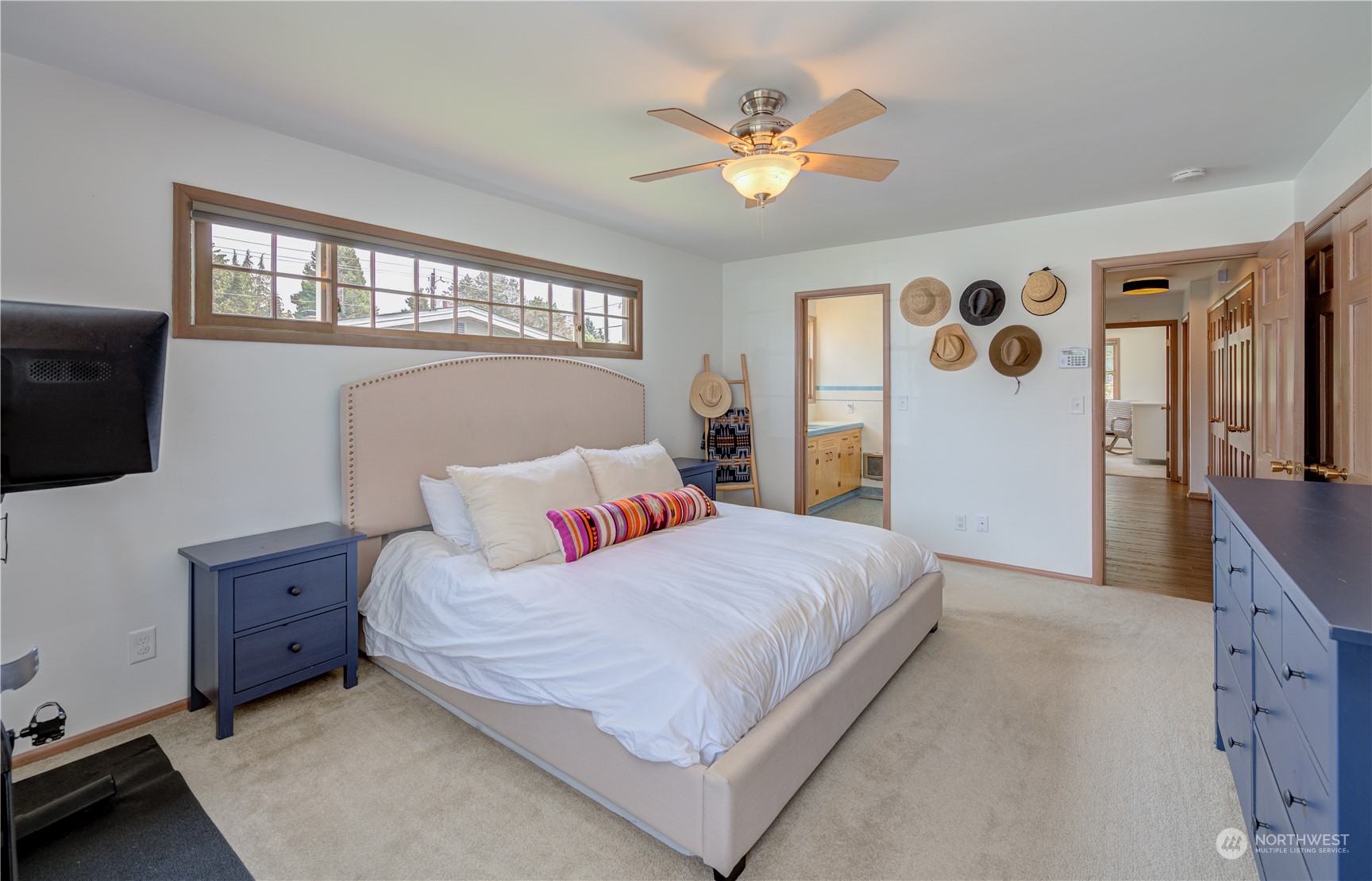 1405 First Street Wenatchee, WA 98801 - Photo 31 of 40 a bedroom with a large bed and a chandelier