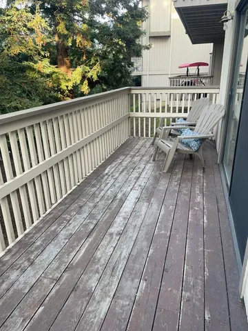 a balcony with wooden floor