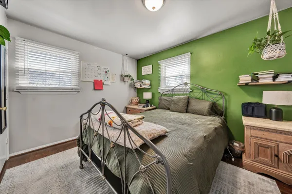 a bed room with furniture and a window