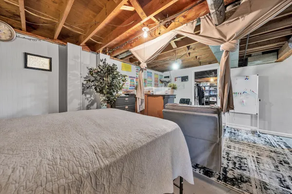 a bed room with a bed and a television