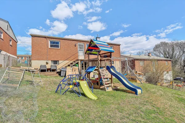 a view of a backyard with a slide