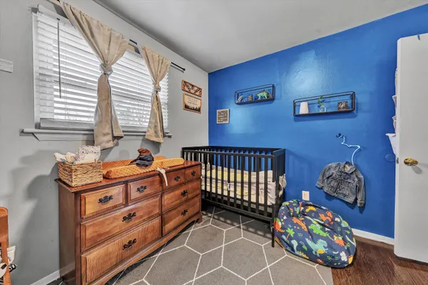 a bedroom with furniture and a window