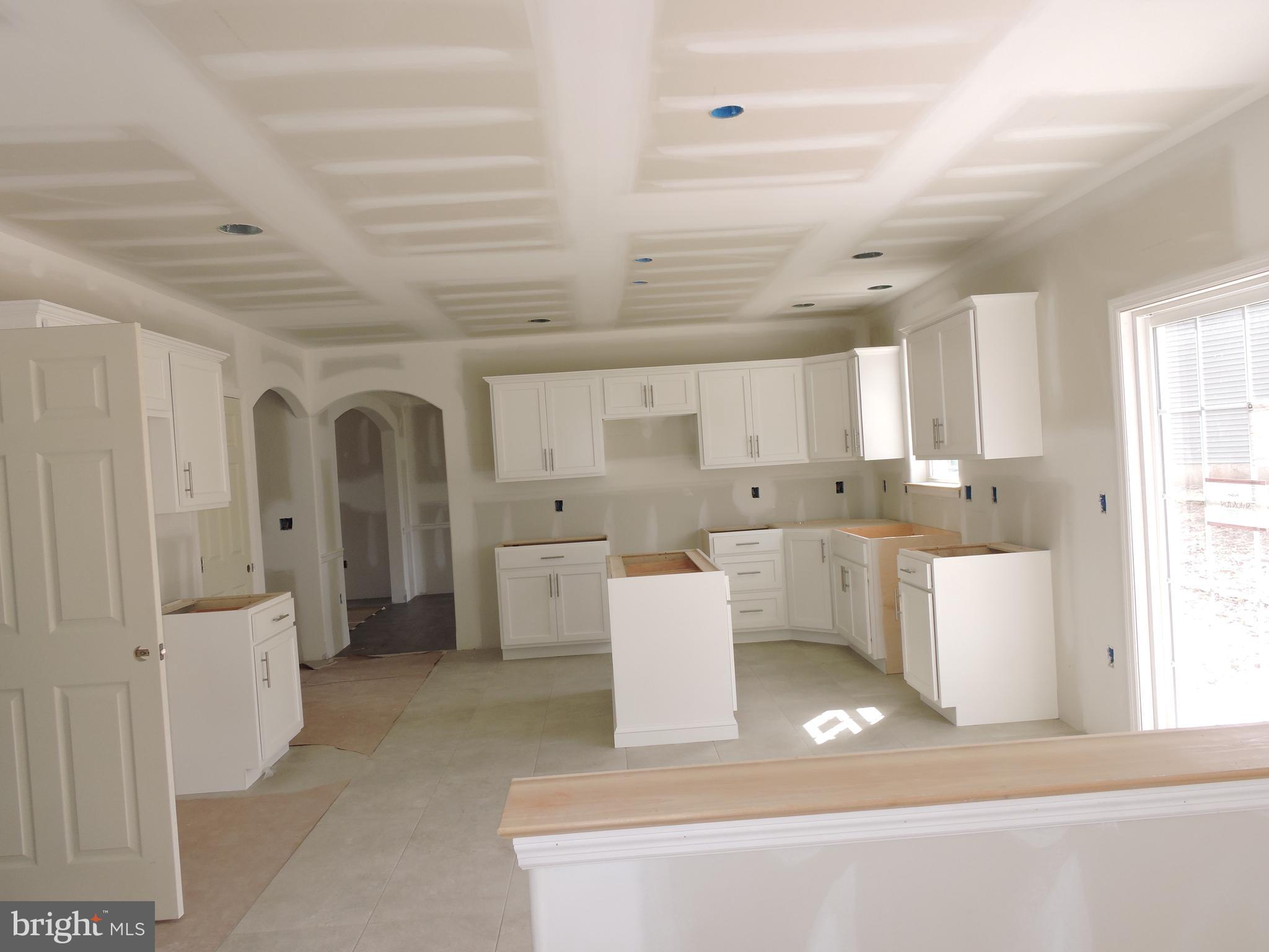 5205 Stoudts Ferry Bridge Road Reading, PA 19605 - Photo 12 of 27 a large white kitchen with a white countertops and cabinets