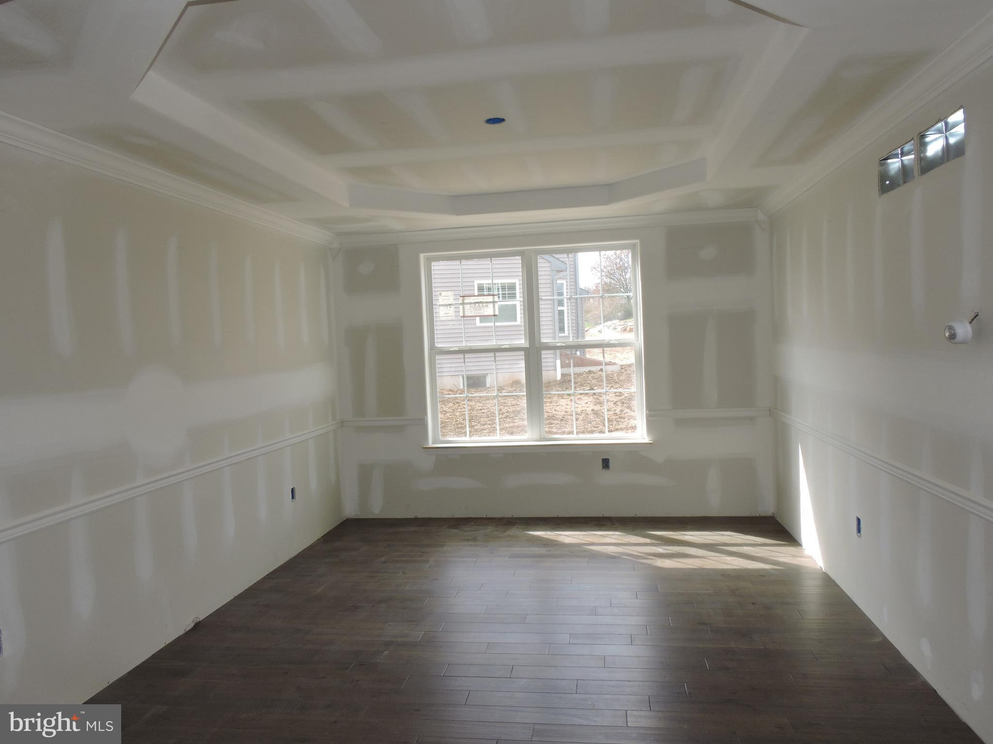 5205 Stoudts Ferry Bridge Road Reading, PA 19605 - Photo 15 of 27 an empty room with wooden floor and windows