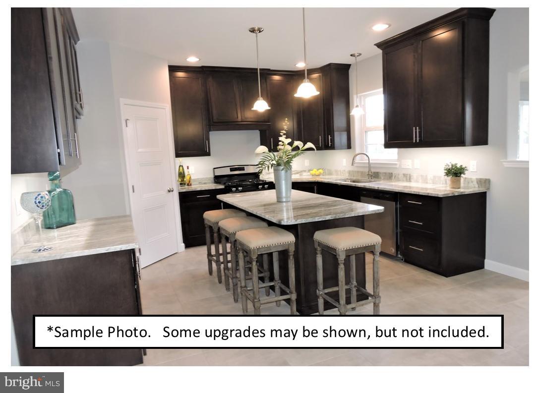 5205 Stoudts Ferry Bridge Road Reading, PA 19605 - Photo 16 of 27 a kitchen with a table and chairs