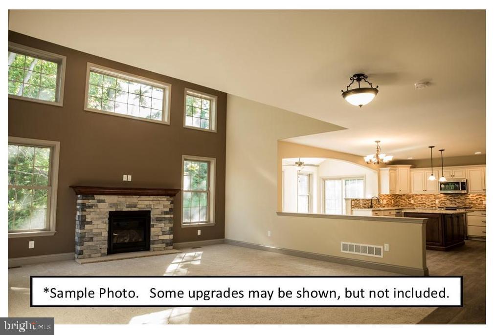 5205 Stoudts Ferry Bridge Road Reading, PA 19605 - Photo 18 of 27 a view of a kitchen with an entryway and a fireplace