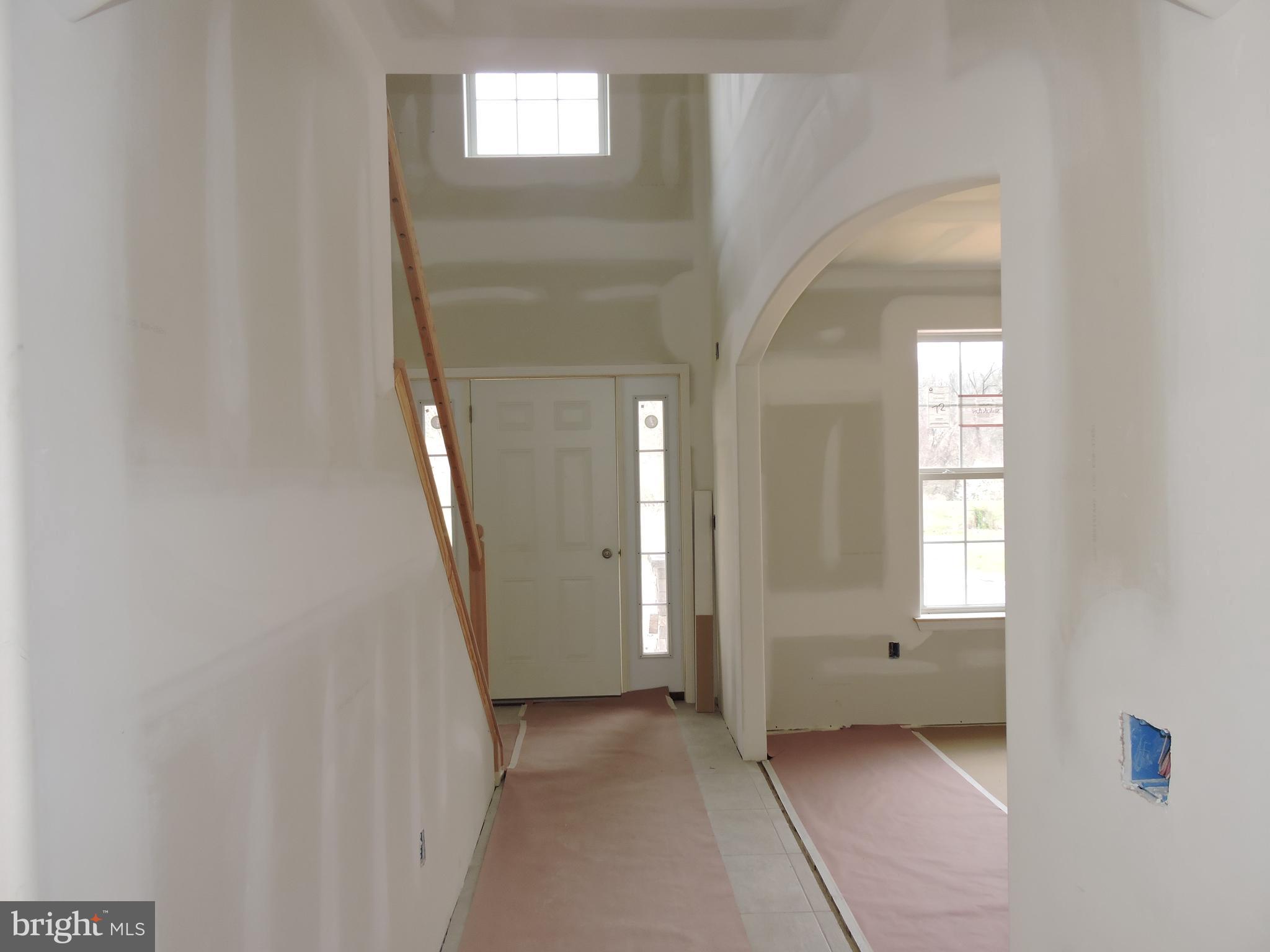 5205 Stoudts Ferry Bridge Road Reading, PA 19605 - Photo 2 of 27 a view of an empty room with window and stairs