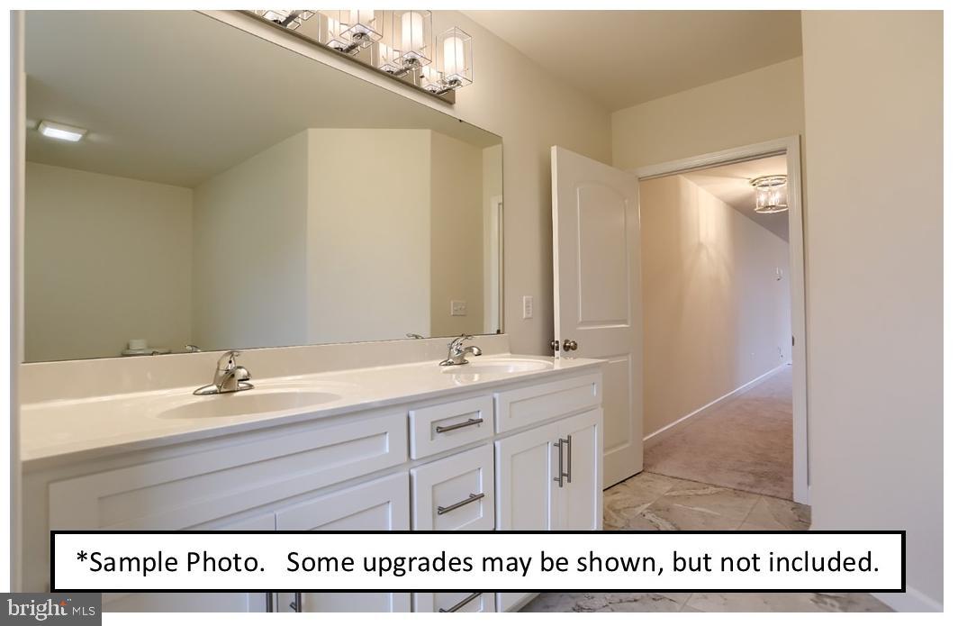5205 Stoudts Ferry Bridge Road Reading, PA 19605 - Photo 22 of 27 a bathroom with a sink a mirror and a bathtub