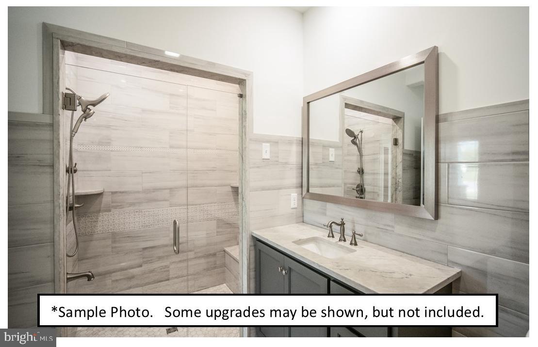 5205 Stoudts Ferry Bridge Road Reading, PA 19605 - Photo 23 of 27 a bathroom with a sink a mirror and a shower