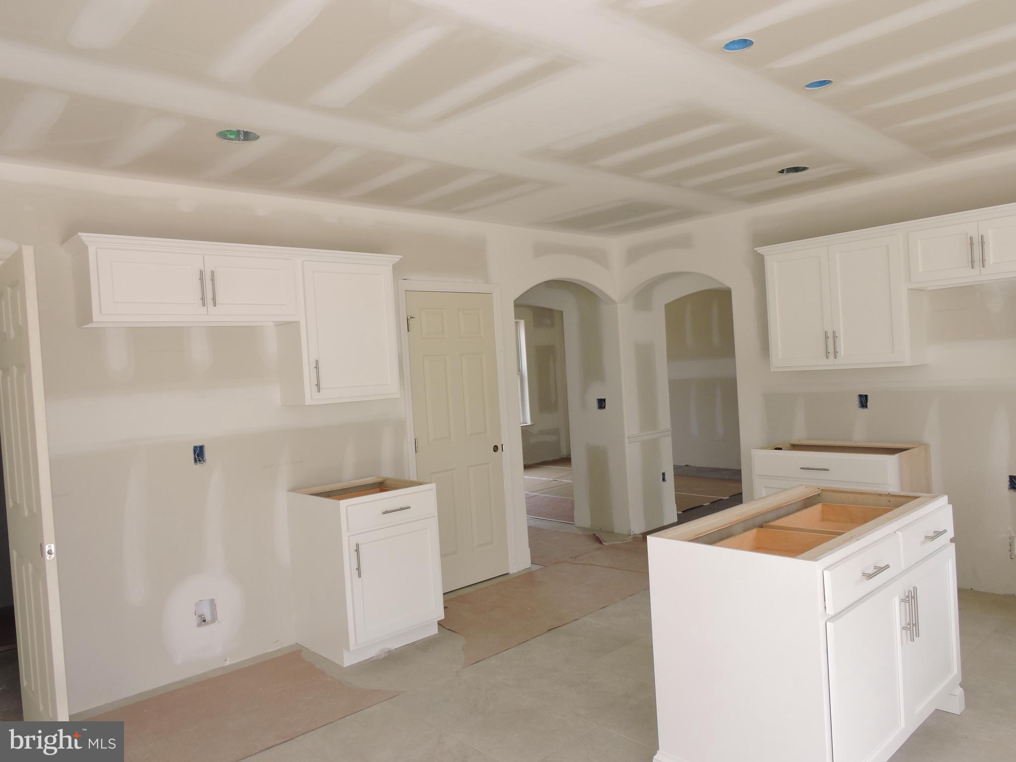 5205 Stoudts Ferry Bridge Road Reading, PA 19605 - Photo 24 of 27 a view of a kitchen with refrigerator and white cabinets
