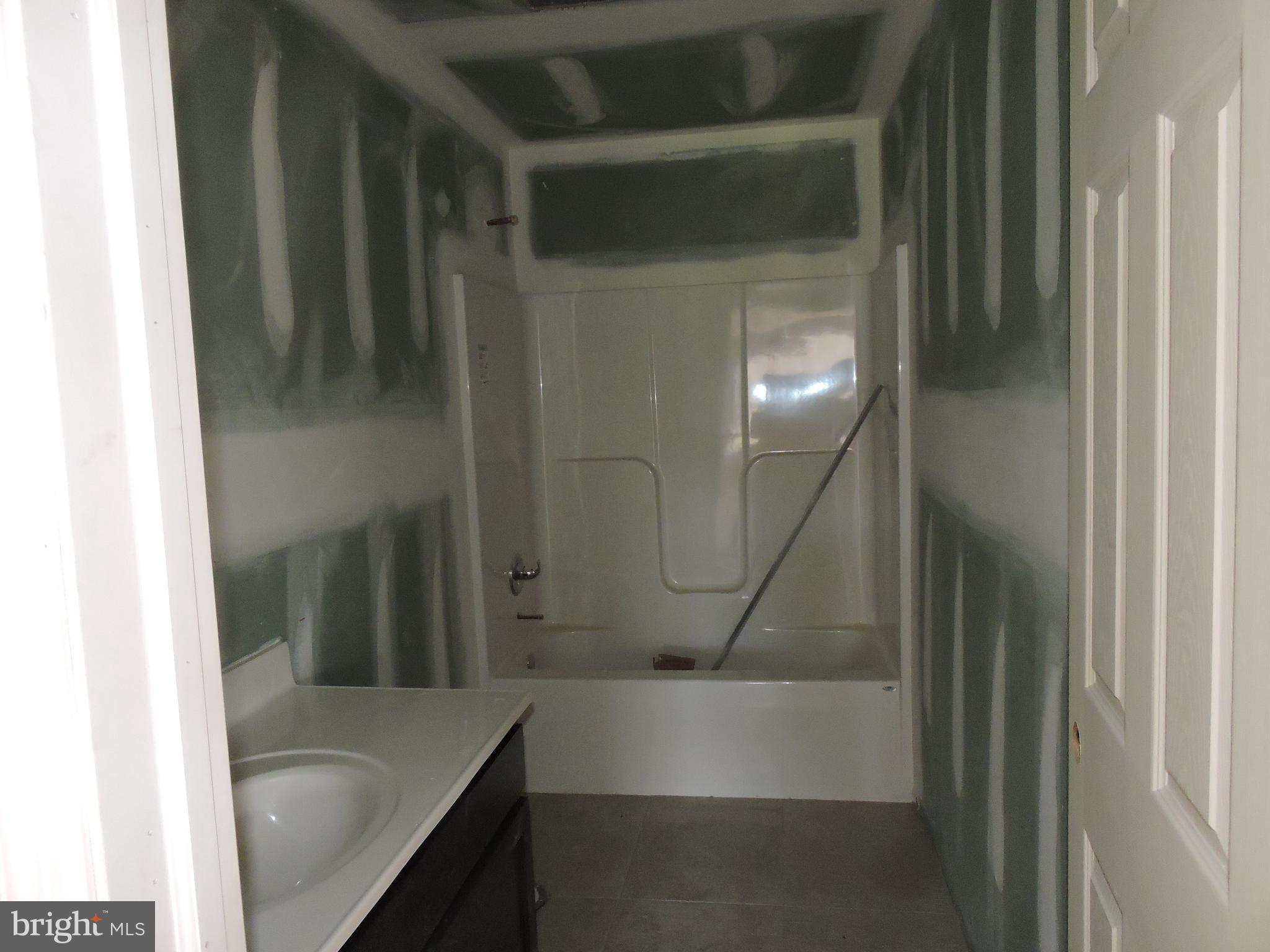 5205 Stoudts Ferry Bridge Road Reading, PA 19605 - Photo 27 of 27 a bathroom with a tub