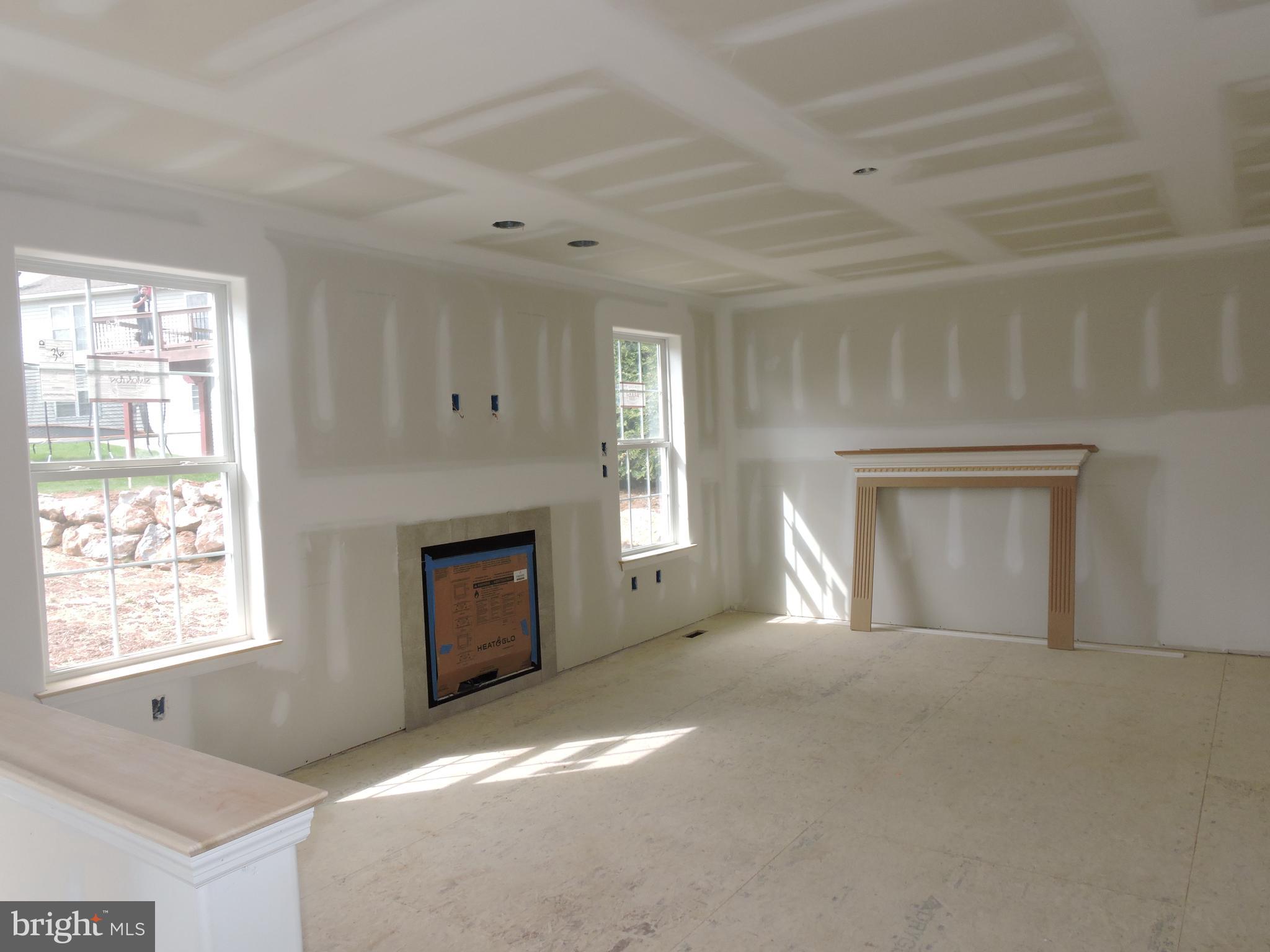 5205 Stoudts Ferry Bridge Road Reading, PA 19605 - Photo 3 of 27 a view of an empty room with a window and fireplace