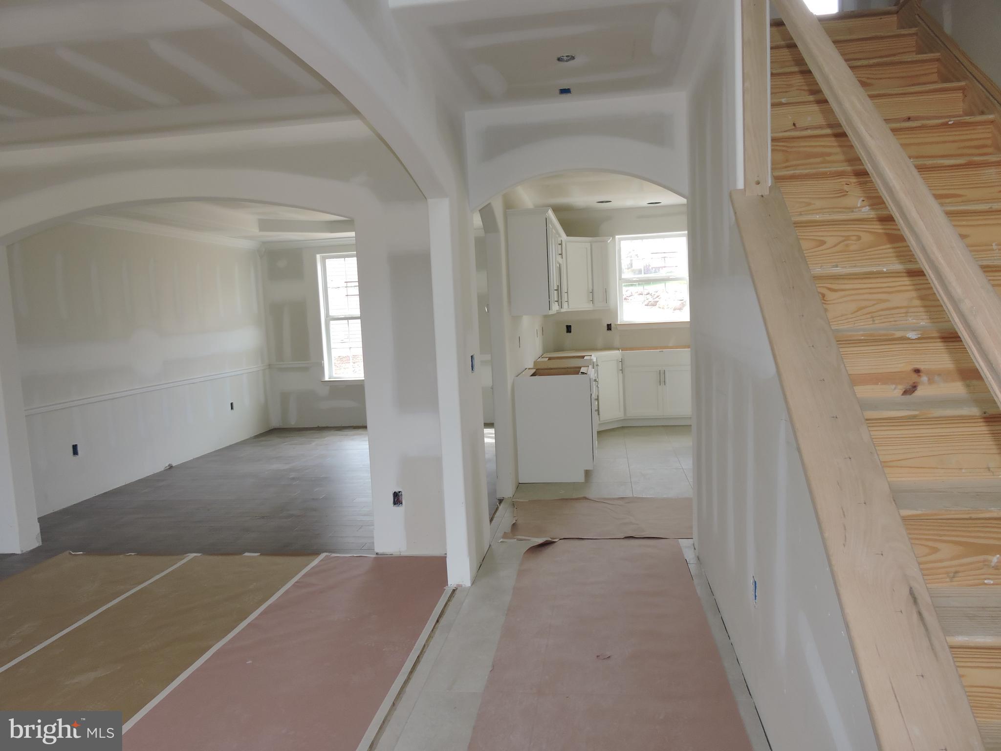 5205 Stoudts Ferry Bridge Road Reading, PA 19605 - Photo 7 of 27 a view of a hallway with wooden floor and staircase