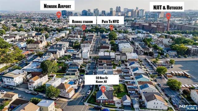 a aerial view of multi story residential apartment building with yard