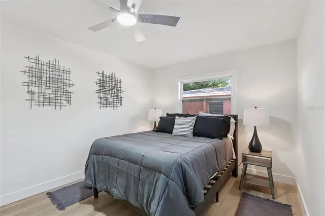 an aerial view of a house with garden space and sitting area