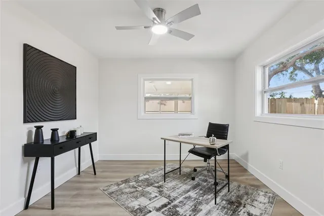 an aerial view of residential houses with outdoor space