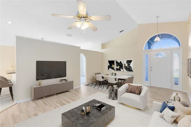 a living room with furniture and a flat screen tv