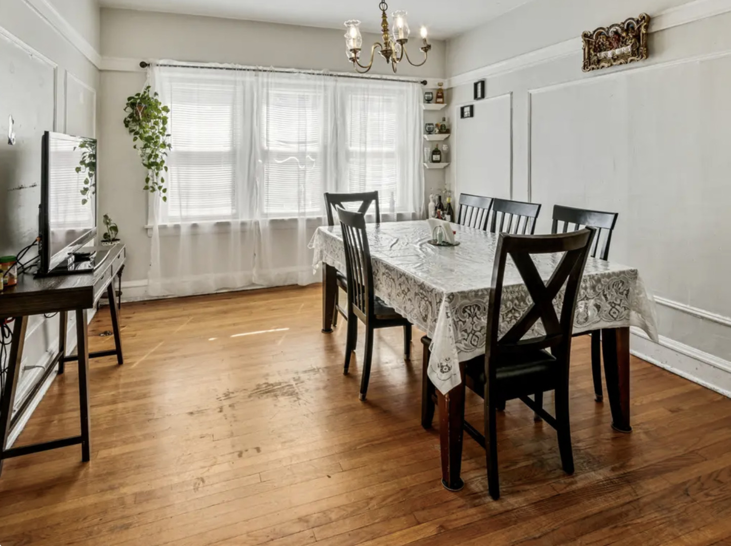 2700 West Albion Avenue, Unit 2 Chicago, IL 60645 - Photo 2 of 8 a view of a dining room with furniture window and wooden floor