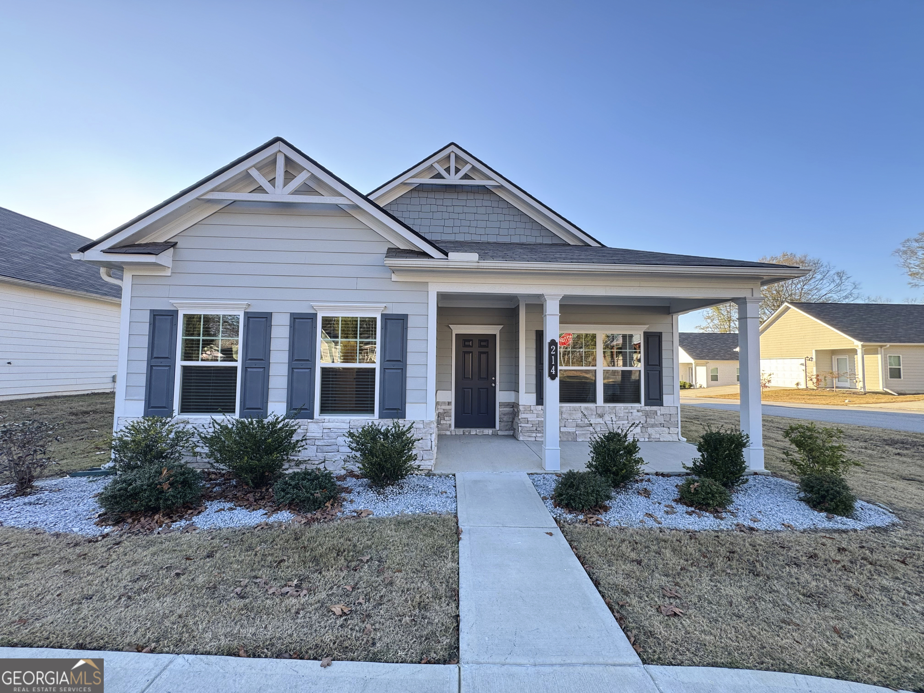 front view of a house with a yard
